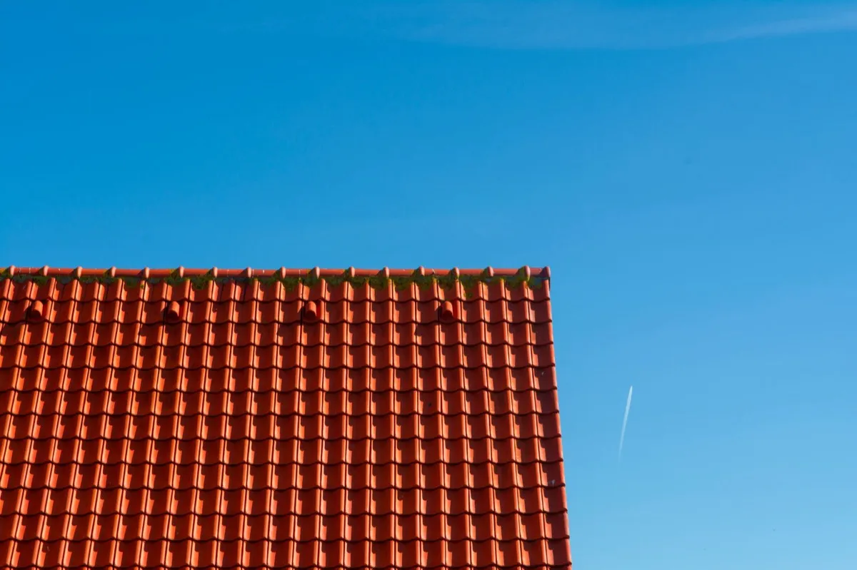 Tile roof gable in full sun, the kind of exposure that sets roof life in Spring Hill, FL